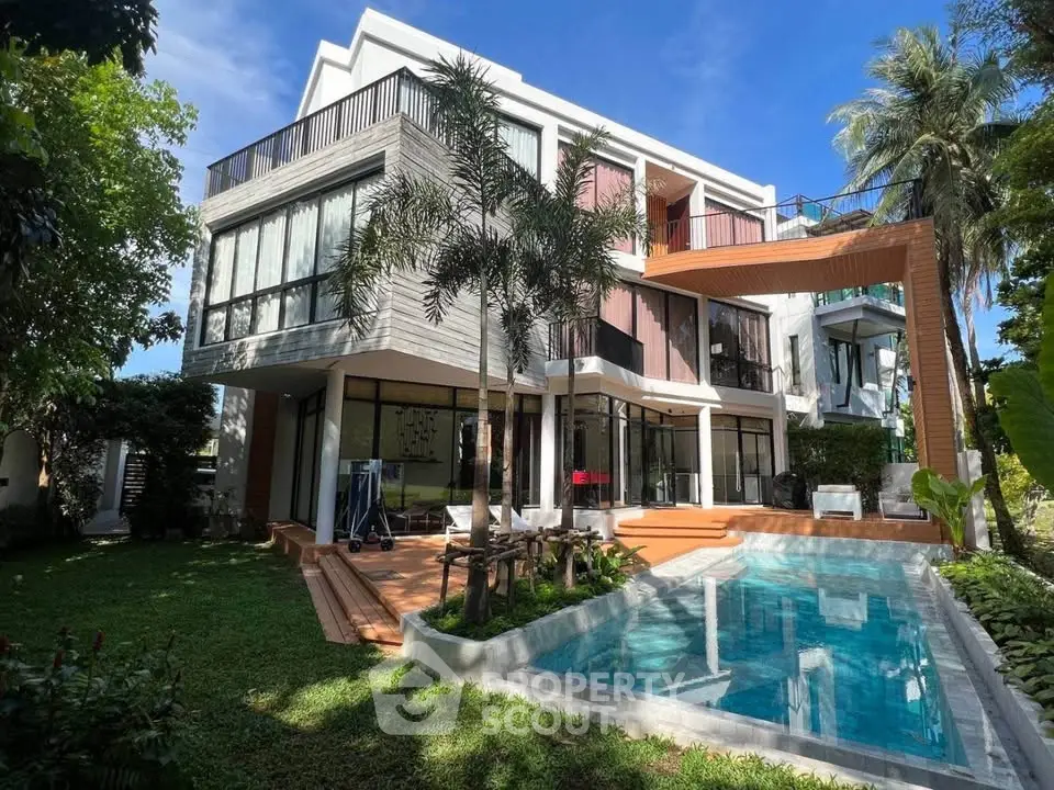 Luxurious modern villa with private pool and lush garden