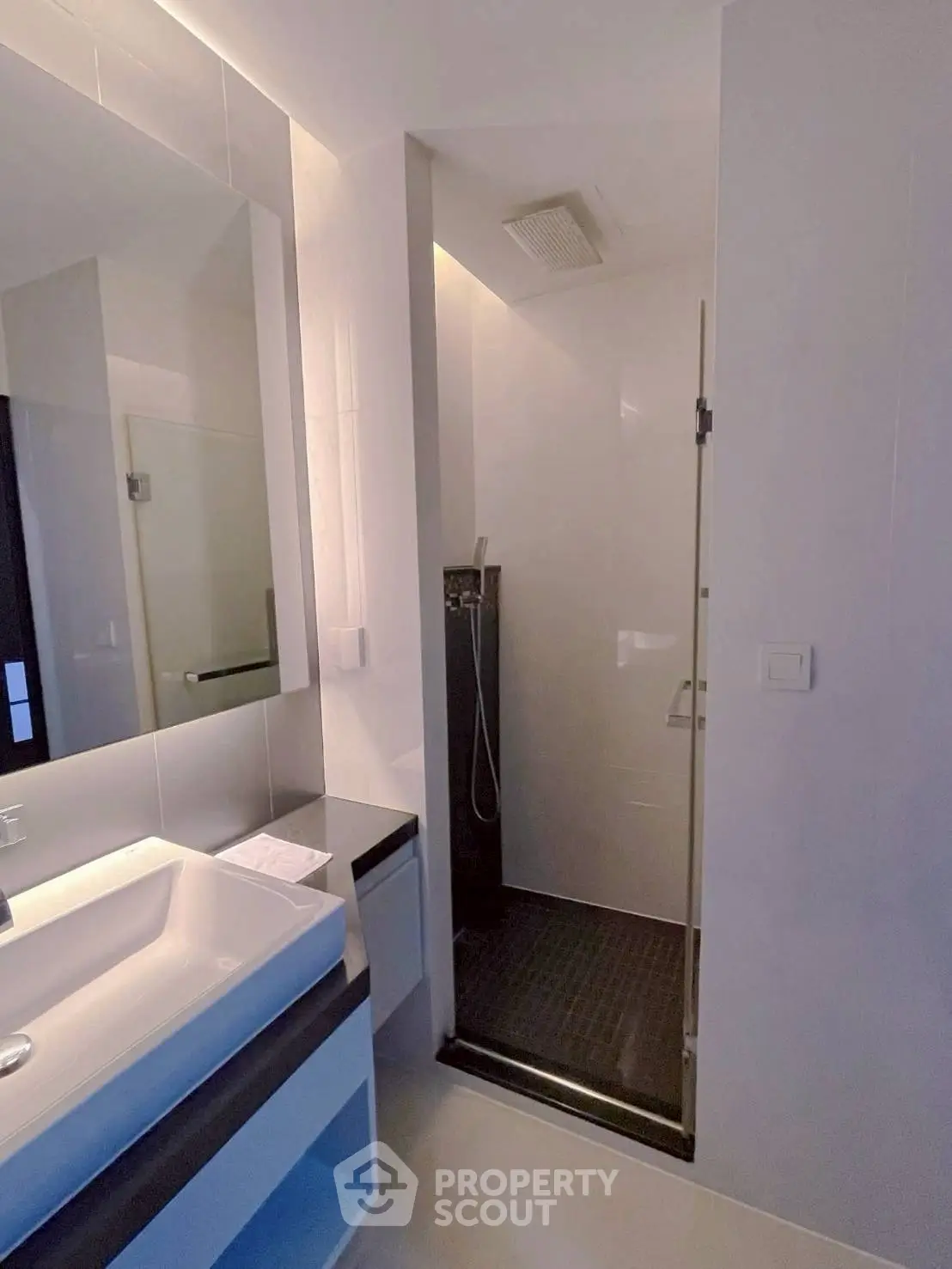 Modern bathroom with sleek shower and stylish sink area