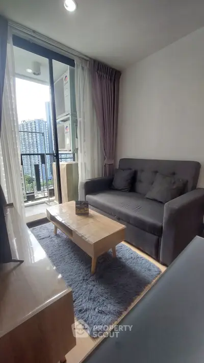 Modern living room with balcony view in urban apartment