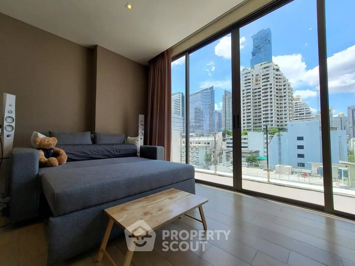 Modern living room with panoramic city view and cozy sofa