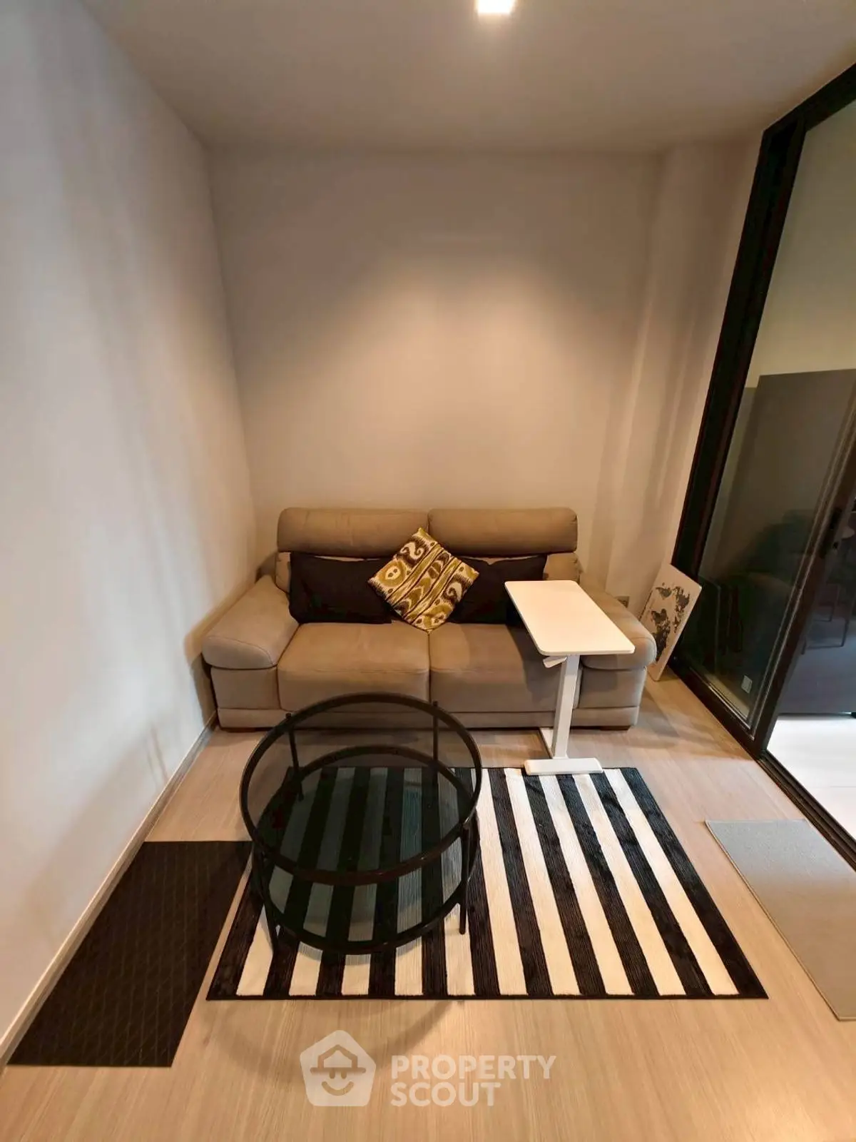 Cozy living room with modern sofa and stylish glass coffee table