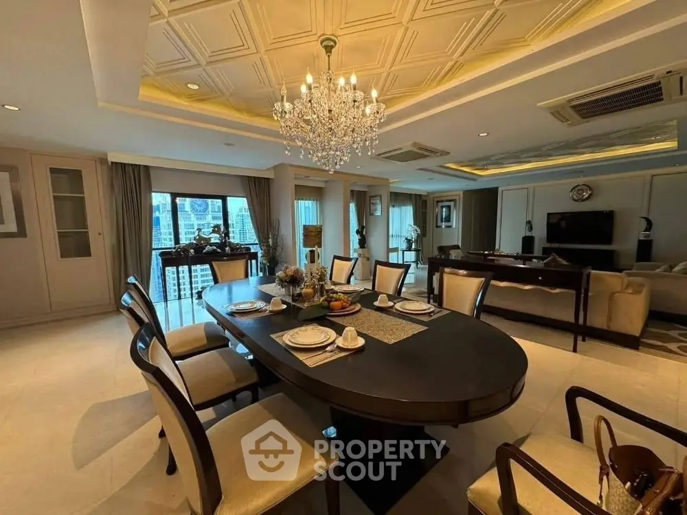 Luxurious dining and living area with elegant chandelier and city view