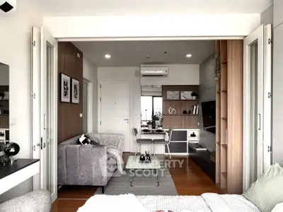 Modern open-plan living room with stylish decor and natural light