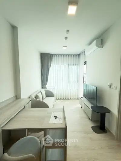 Modern living room with sleek furniture and natural light