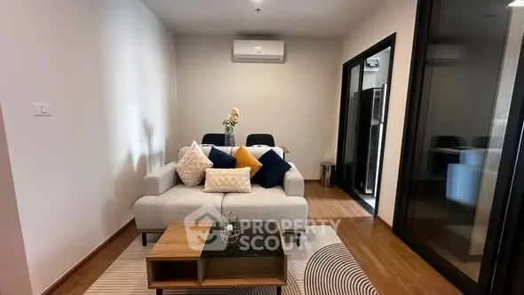 Modern living room with stylish decor and air conditioning in a cozy apartment.