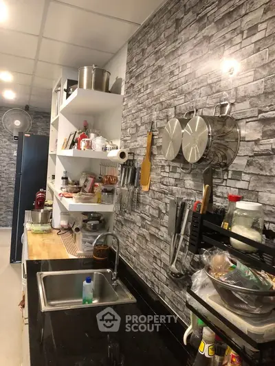 Modern kitchen with stone accent wall and open shelving