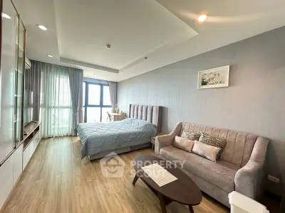 Modern bedroom with stylish decor and cozy seating area
