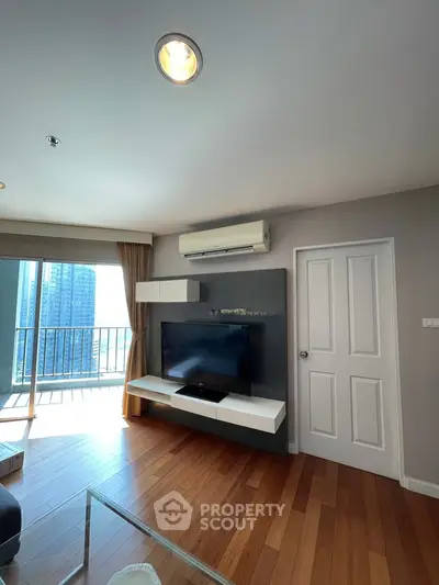 Modern living room with balcony view and sleek wooden flooring