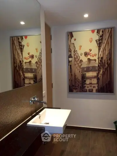 Modern bathroom with stylish wall art and sleek fixtures