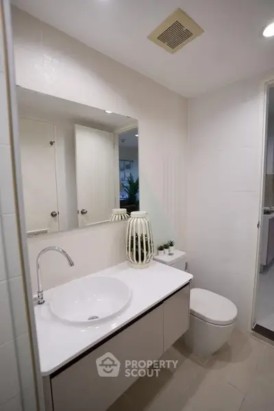 Modern bathroom with sleek fixtures and elegant decor in a contemporary home.