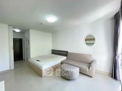 Spacious studio apartment with modern furnishings and natural light