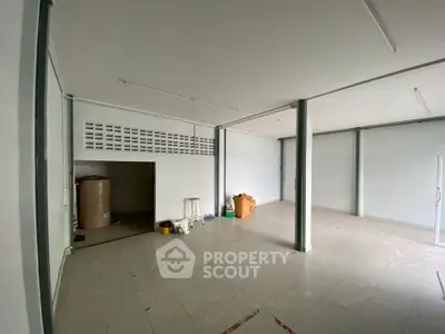 Spacious commercial space with tiled flooring and open layout, ideal for business setup.