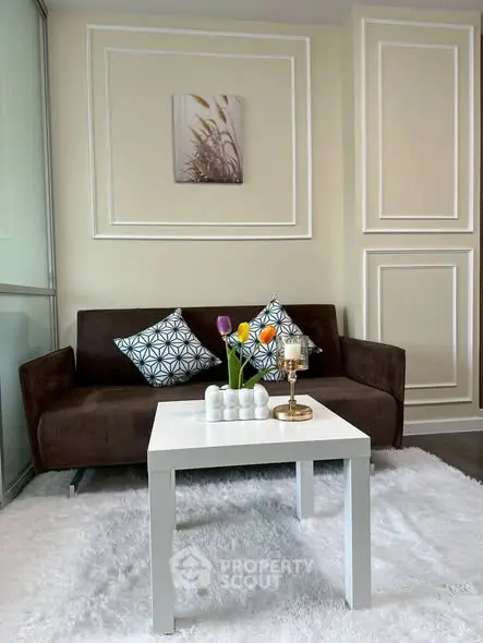 Stylish living room with modern decor and cozy seating area.