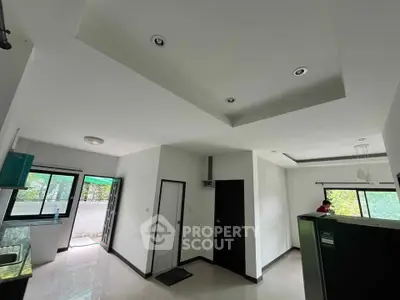 Spacious modern interior with sleek design and abundant natural light, featuring open layout and stylish finishes.