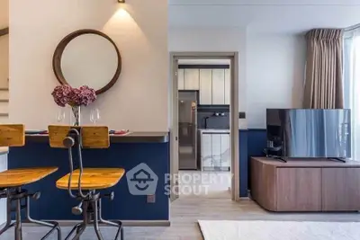 Modern living room with stylish decor and open kitchen layout