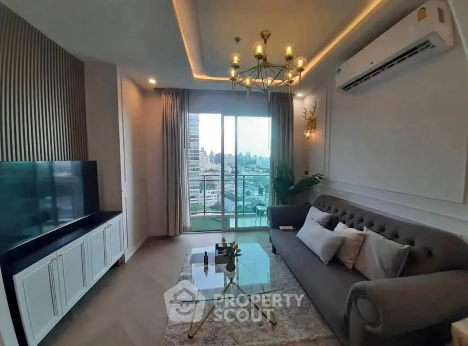 Elegant living room with city view, featuring modern decor and large windows for natural light.