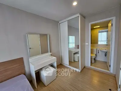 Modern bedroom with ensuite bathroom and mirrored wardrobe