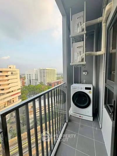 Modern balcony with washing machine and city view, perfect for urban living.