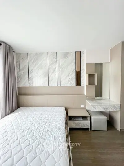 Modern bedroom with stylish decor and ample natural light