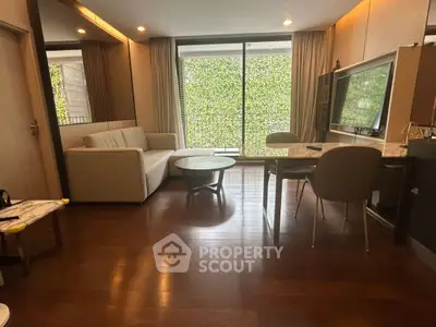 Modern living room with elegant furniture and large window view