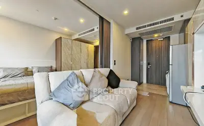 Modern studio apartment with cozy living area and stylish bedroom