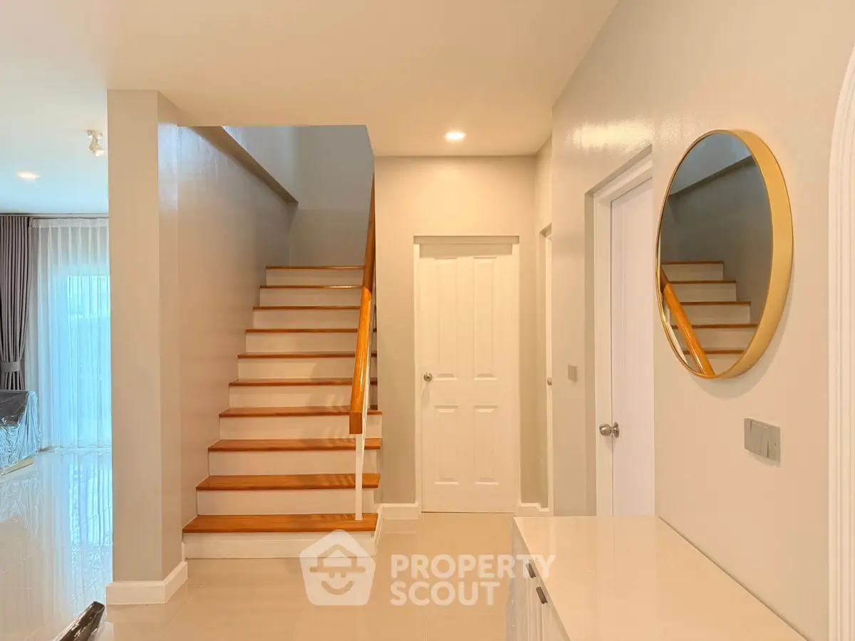 Elegant modern interior with staircase and stylish decor