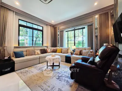 Luxurious living room with elegant decor and large windows offering natural light