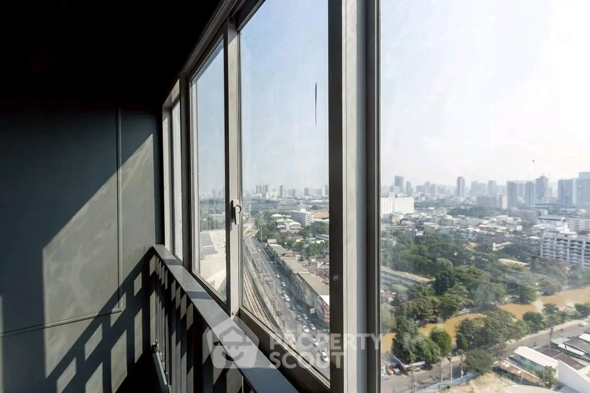 Stunning cityscape view from a high-rise balcony with expansive skyline.