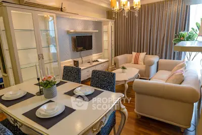 Elegant living room with classic furniture and dining area, featuring a cozy ambiance and stylish decor.