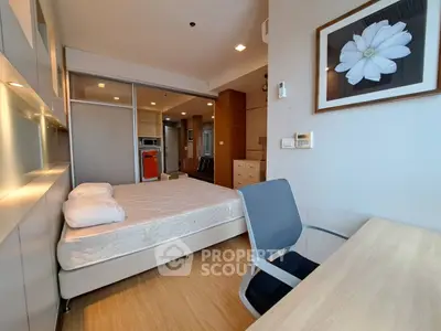 Modern studio apartment with cozy bedroom and open kitchen layout