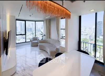 Luxurious modern living room with panoramic city views and elegant chandelier