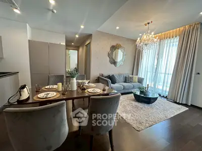 Luxurious living room with elegant dining area and chandelier in modern apartment