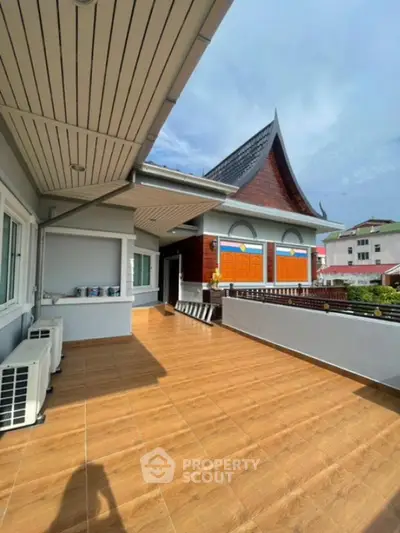 Spacious balcony with traditional architectural design and modern amenities