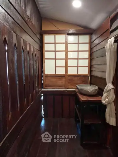 Charming rustic interior with wooden walls and traditional window design