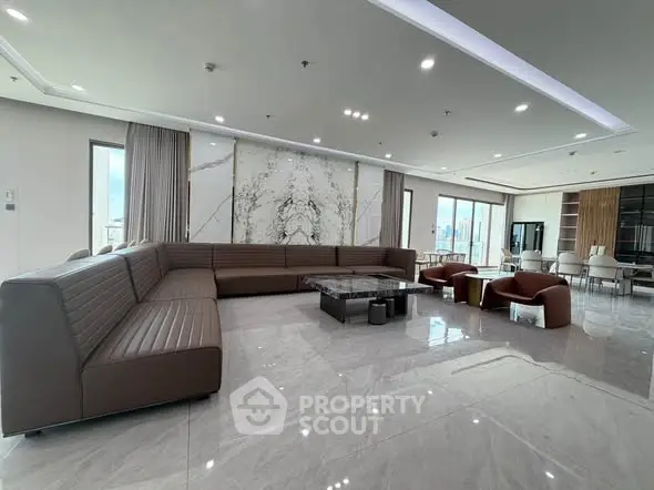 Luxurious modern living room with marble floors and panoramic city views