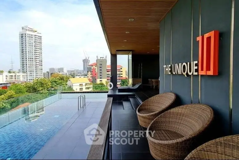 Luxurious rooftop pool with stunning city view at The Unique 10 residence.