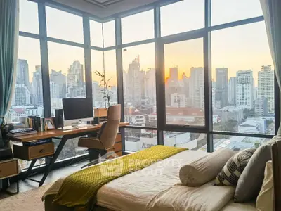 Luxurious bedroom with stunning city skyline view, featuring modern decor and ample natural light.