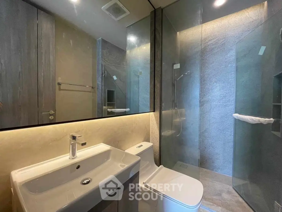 Modern bathroom with sleek design and glass shower enclosure