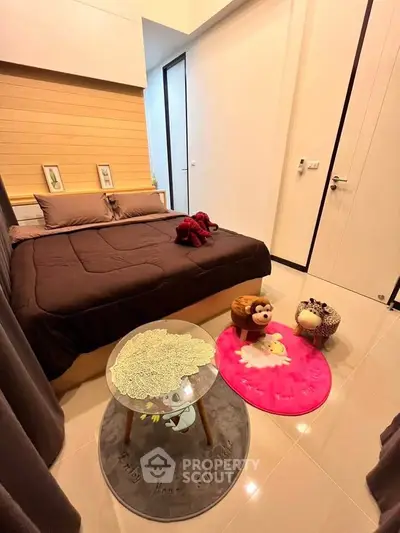 Cozy bedroom with plush toys and modern decor, perfect for a child's retreat.