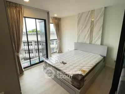 Modern bedroom with large windows and stylish decor in urban apartment