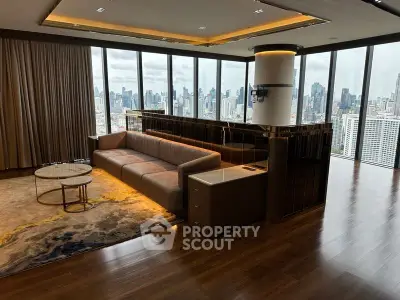 Luxurious corner unit living room with panoramic city views and elegant furnishings.