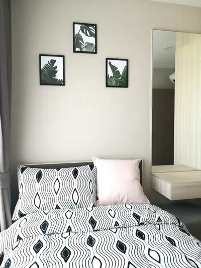 Modern bedroom with stylish decor and patterned bedding
