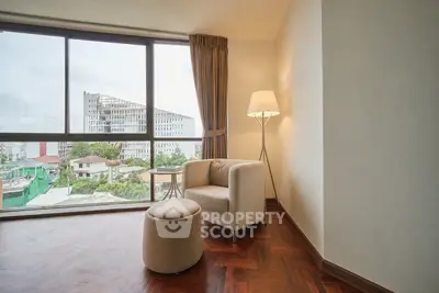 Spacious living room with panoramic city view and elegant decor