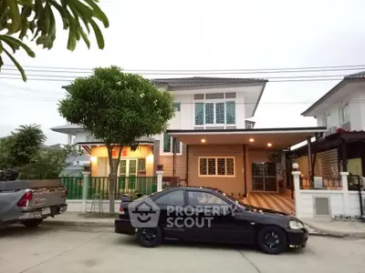 Charming suburban house with spacious driveway and modern exterior design.