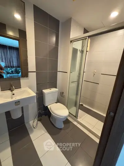 Modern bathroom with sleek design and glass shower enclosure