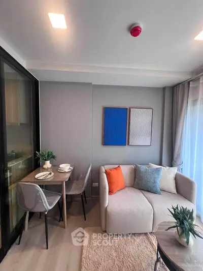 Modern living room with stylish decor and cozy seating area in a contemporary apartment.