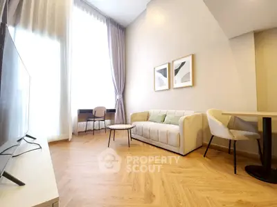 Bright modern living room with high ceilings and stylish furniture