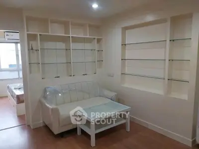 Modern living room with built-in shelves and cozy seating area