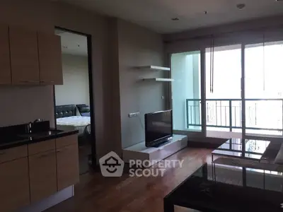 Modern apartment living room with balcony and sleek furnishings