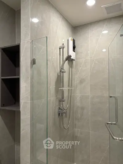 Modern bathroom with sleek glass shower and elegant tile design